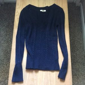 Woman’s navy blue sweater